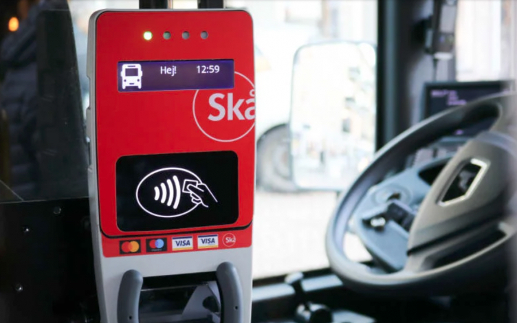 Validator on board Skånetrafiken bus for contactless open-loop payments.
